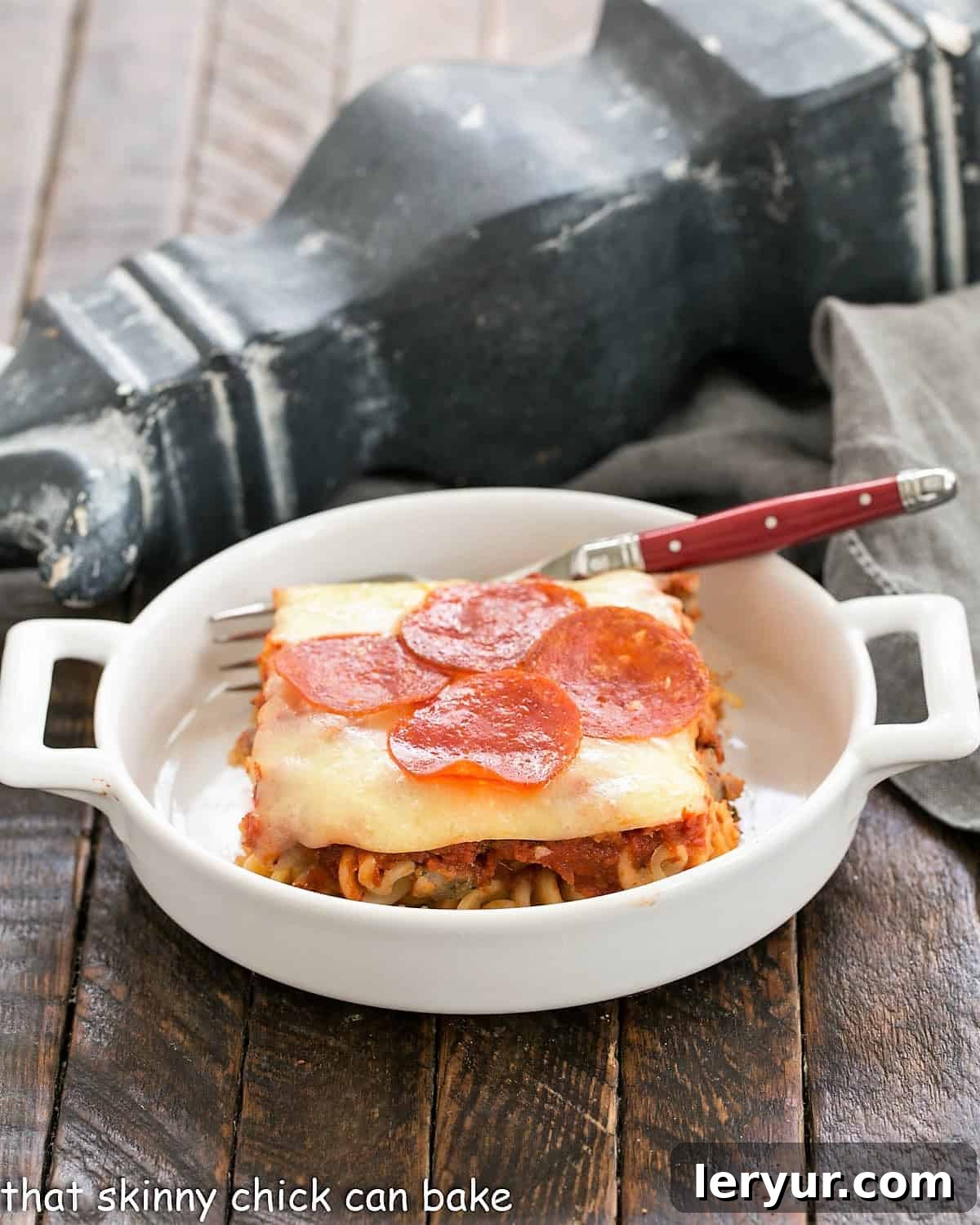 Effortless Pizza Delight 3 Side view of pizza bake in a small white casserole dish.
