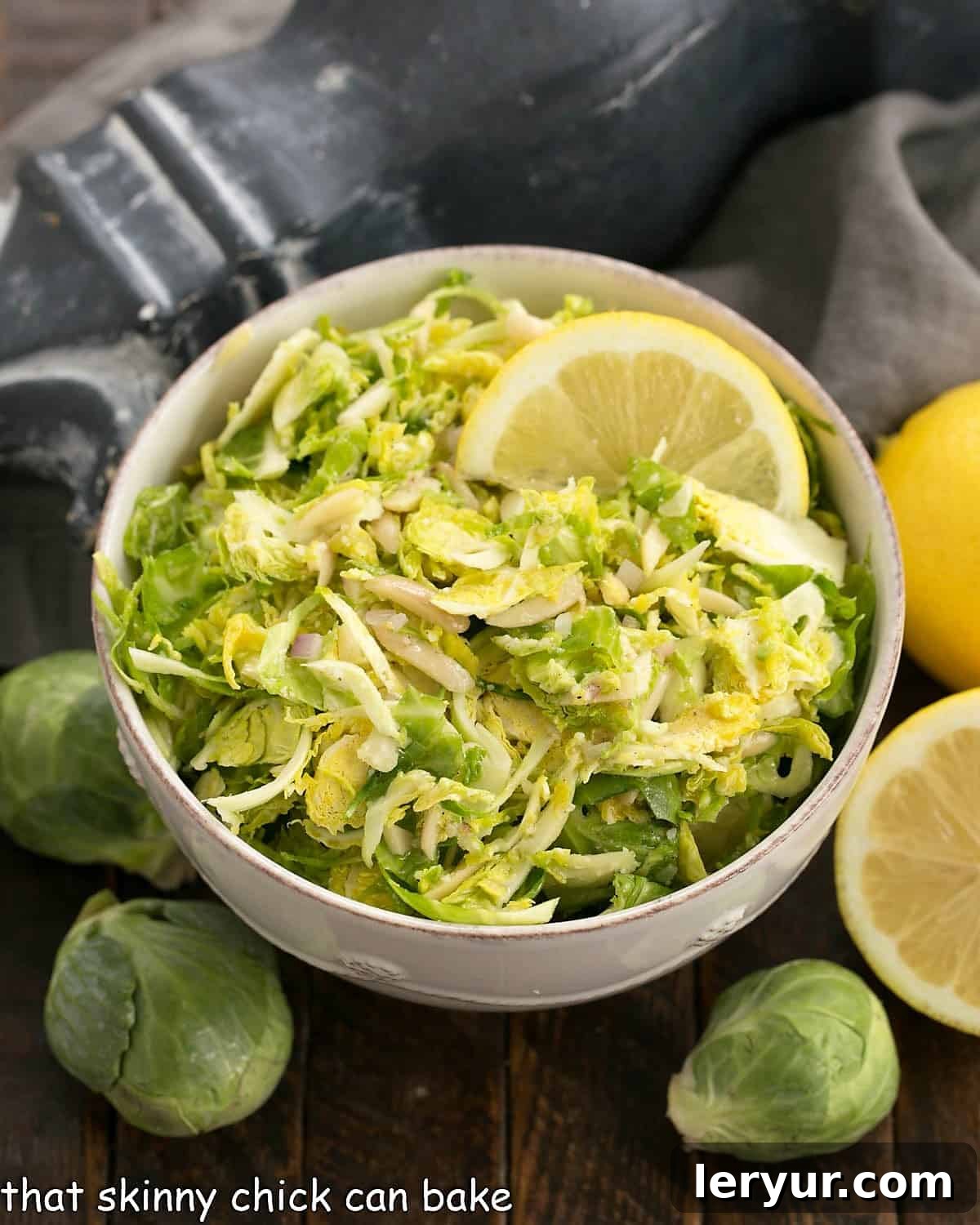Crisp, refreshing Shaved Brussels Sprouts Salad with a lemony Dijon dressing - a healthy, delicious side dish! #healthy #salad #Brusselssprouts #lemon #almonds #Dijon #thatskinnychickcanbake Crisp, refreshing Shaved Brussels Sprouts Salad with a lemony Dijon dressing - a healthy, delicious side dish!