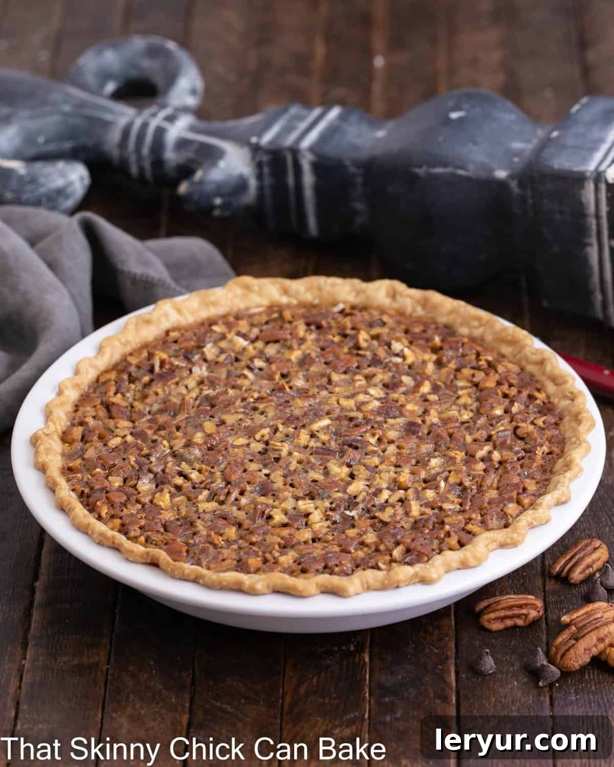 Decadent Chocolate Pecan Indulgence 3 Side view of whole, uncut chocolate pecan pie recipe.