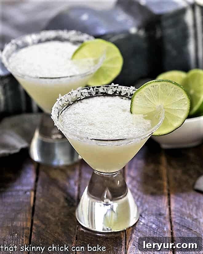 Easy 3-Ingredient Beer Margaritas in martini glasses with lime garnishes, ready to serve.