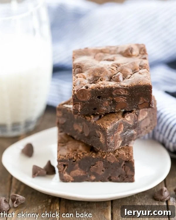 Rich and fudgy cocoa brownies stacked, perfect for a college care package