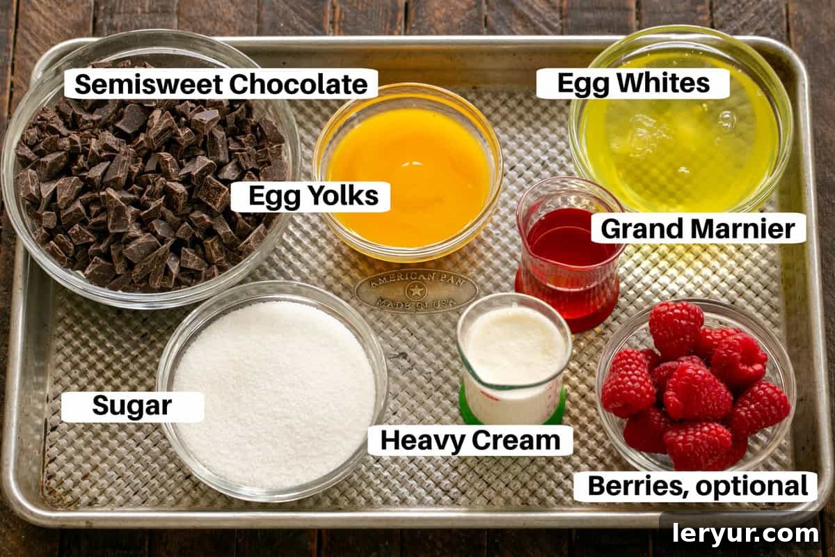 Julia Child's Legendary French Chocolate Mousse 2 Chocolate Mousse ingredients with labels on a metal sheet pan, showcasing high-quality chocolate, fresh eggs, butter, and coffee.