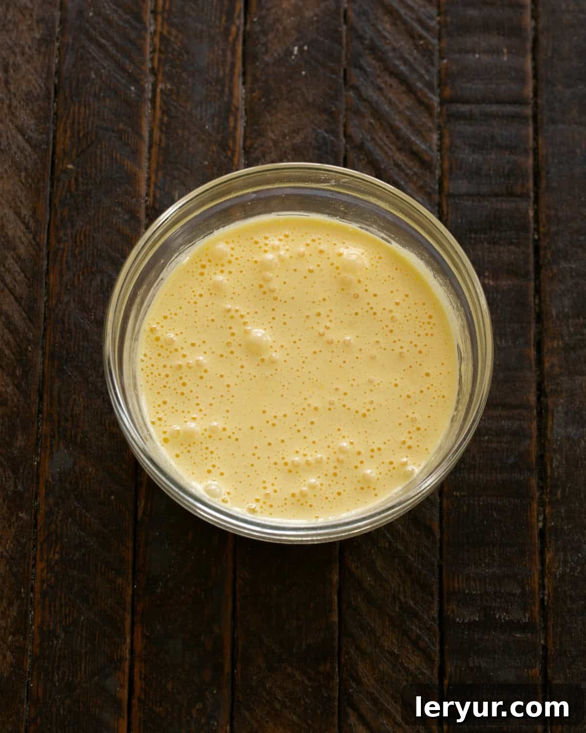 Julia Child's Legendary French Chocolate Mousse 4 Step-by-step image of whisking egg yolks with sugar.