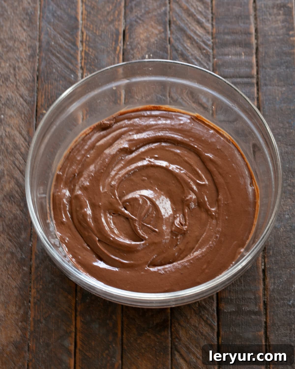 Julia Child's Legendary French Chocolate Mousse 6 Step-by-step image of adding chocolate, orange liqueur, and cream to the yolk mixture.