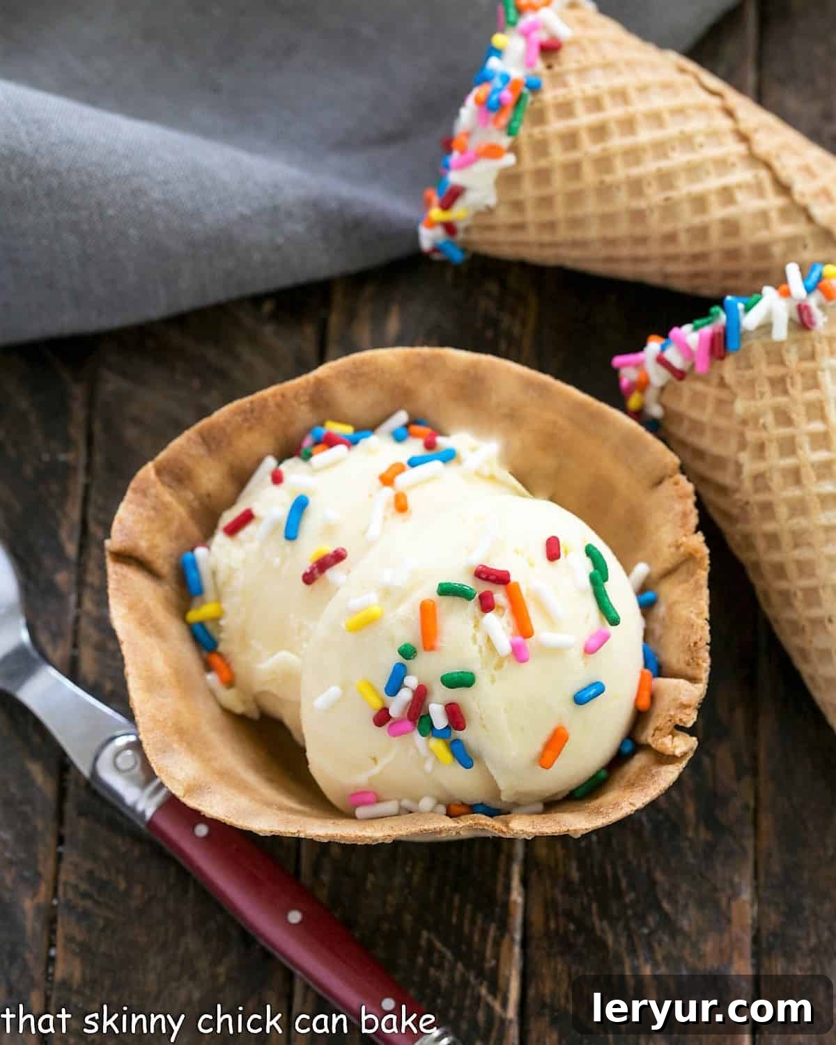 Birthday Cake Batter Dream 2 Three perfectly scooped portions of Cake Batter Ice Cream, one in a glass dish, and two in sprinkle-dipped sugar cones, ready for a party.