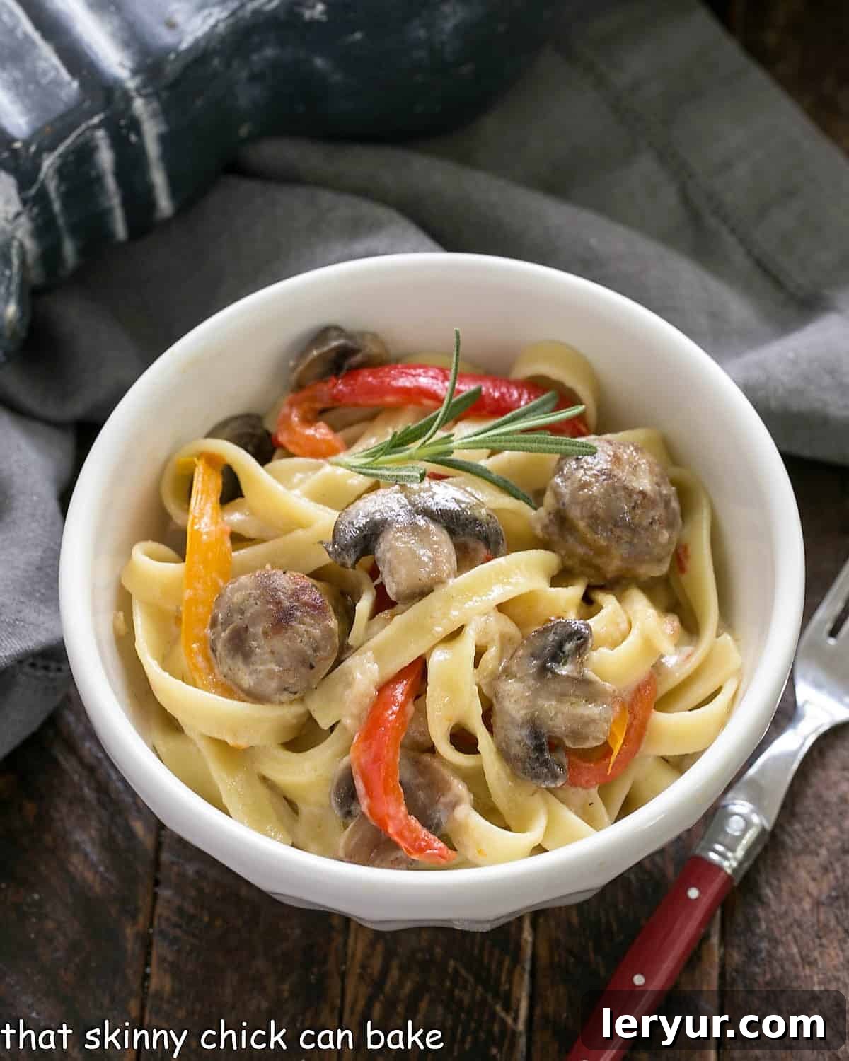 Sausage, Pepper, Mushroom Fettuccine - a twist on the classic Fettuccine Alfredo with the addition of bell peppers, mushrooms and sausage Overhead view of a beautiful, creamy bowl of Sausage, Pepper, Mushroom Fettuccine.