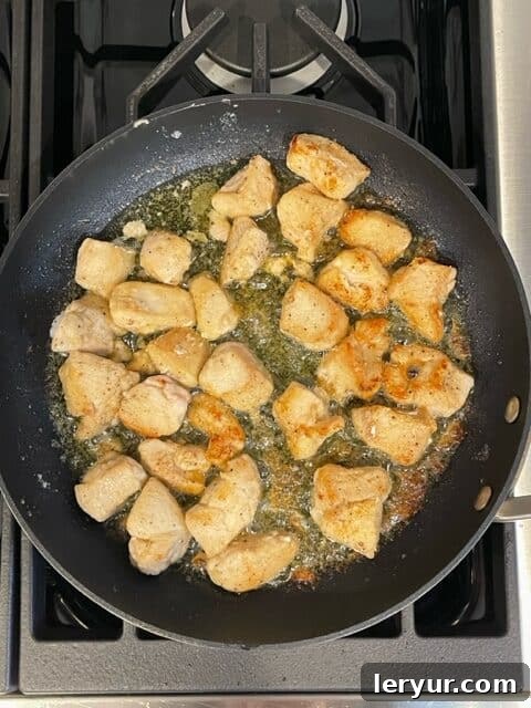 Zesty Garlic Parsley Chicken 4 Pan-frying floured chicken cubes until golden brown.