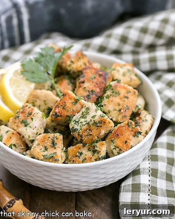 Chicken with Garlic and Parsley - Easy, delicious and flavorful with only a few ingredients and finished in less than 30 minutes! Chicken with Garlic and Parsley in a white bowl with a green and white checked napkin, presented beautifully.