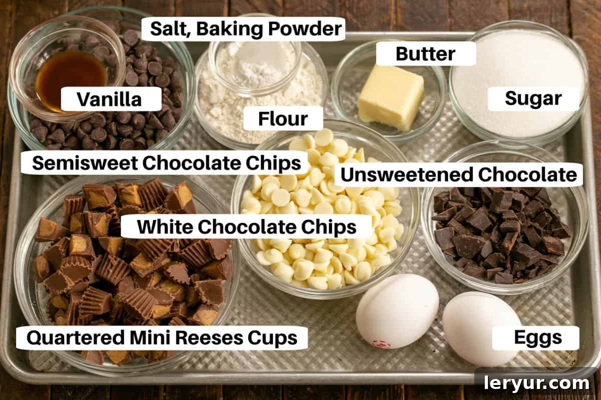 Ultimate Peanut Butter Fudge Swirl Cookies 3 A flat lay of all the Moose Tracks Cookies ingredients laid out on a baking sheet with individual labels.