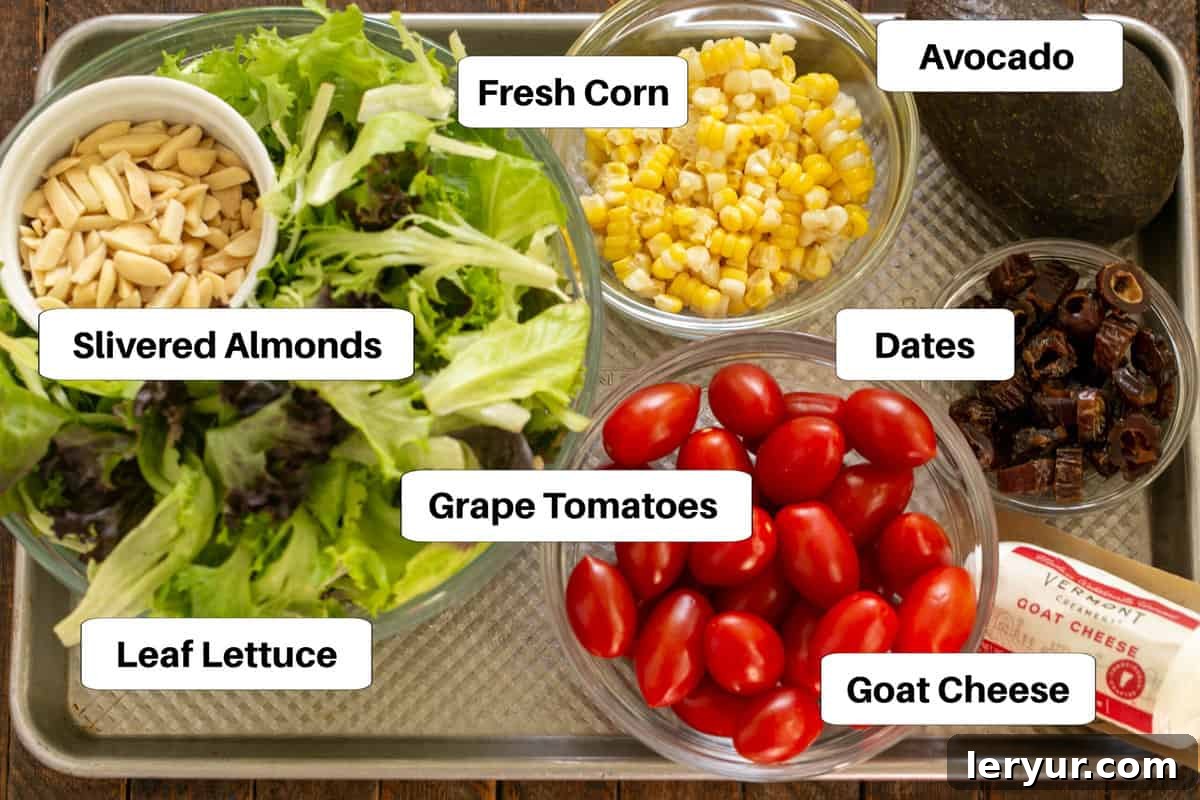 Macho Salad ingredients with labels on a sheet pan.