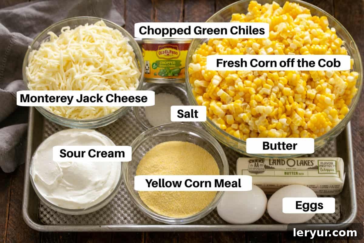 Corn Casserole Ingredients with labels on a metal sheet pan.