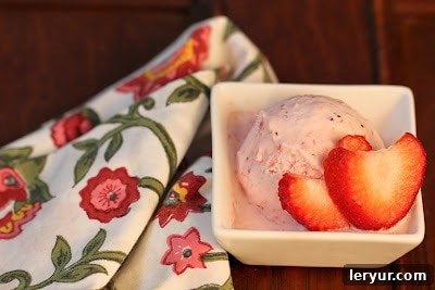 Strawberry Mascarpone Bliss 3 Close-up view of a perfectly scooped serving of strawberry mascarpone ice cream in a small white square bowl
