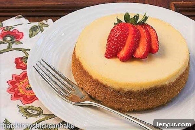 Shattered Sugar Cheesecake 2 Crème Brûlée Cheesecake topped with a fanned strawberry