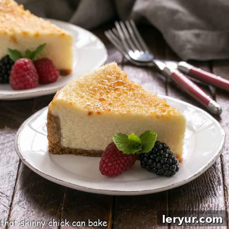 Creme Brulee cheesecake slice on a white dessert plate