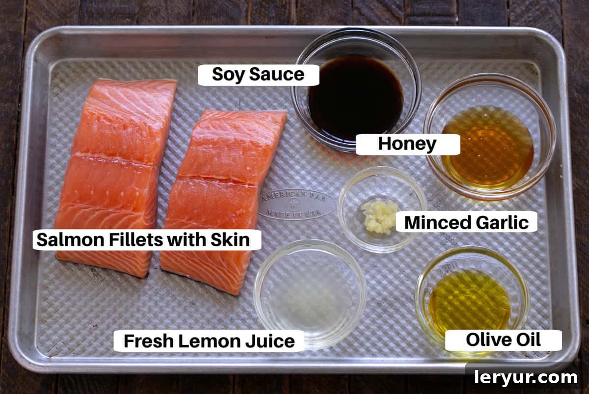 Grilled Salmon Date Night 3 Marinated Salmon for Two Ingredients laid out on a sheet pan with text labels for each component.