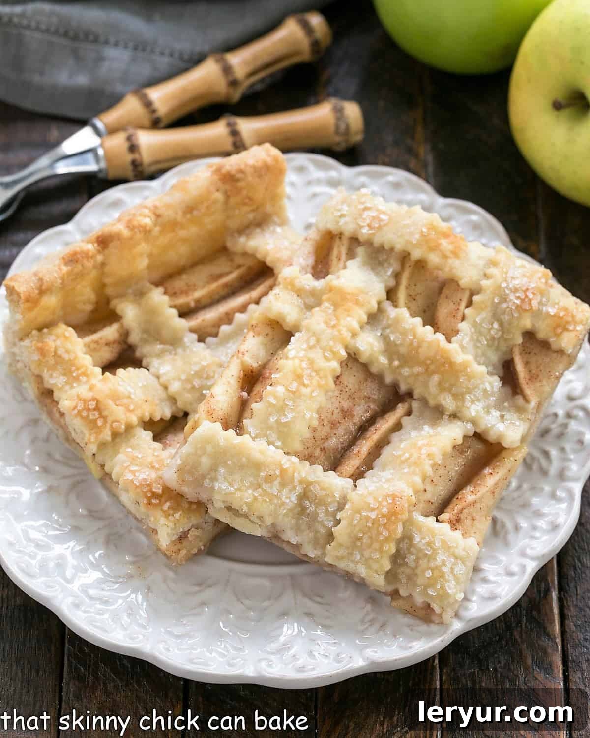 2 slices of Cinnamon Apple Squares on a round white plate.