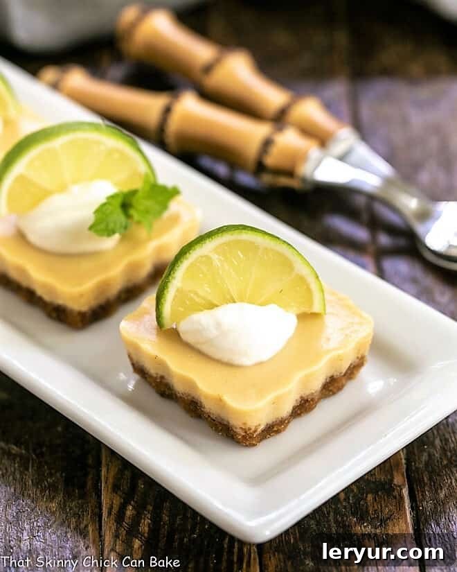 Key Lime Tartlets on a white tray, showcasing their vibrant color and delicate crust.