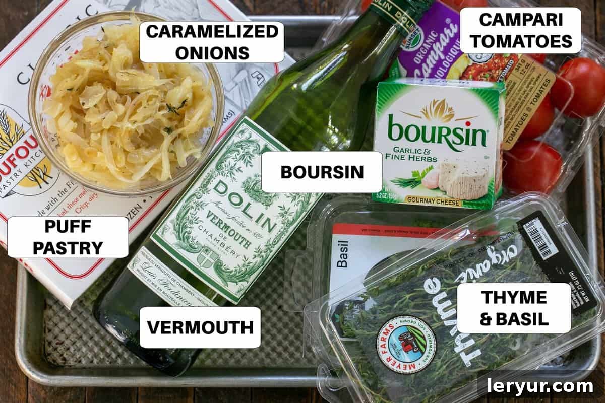 Tomato Boursin Tarts Ingredients with labels on a sheet pan, neatly arranged and ready for preparation.