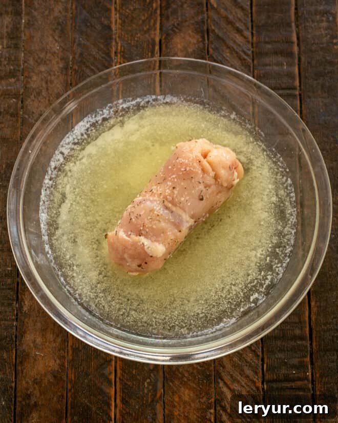 Step 5 making chicken cordon bleu.