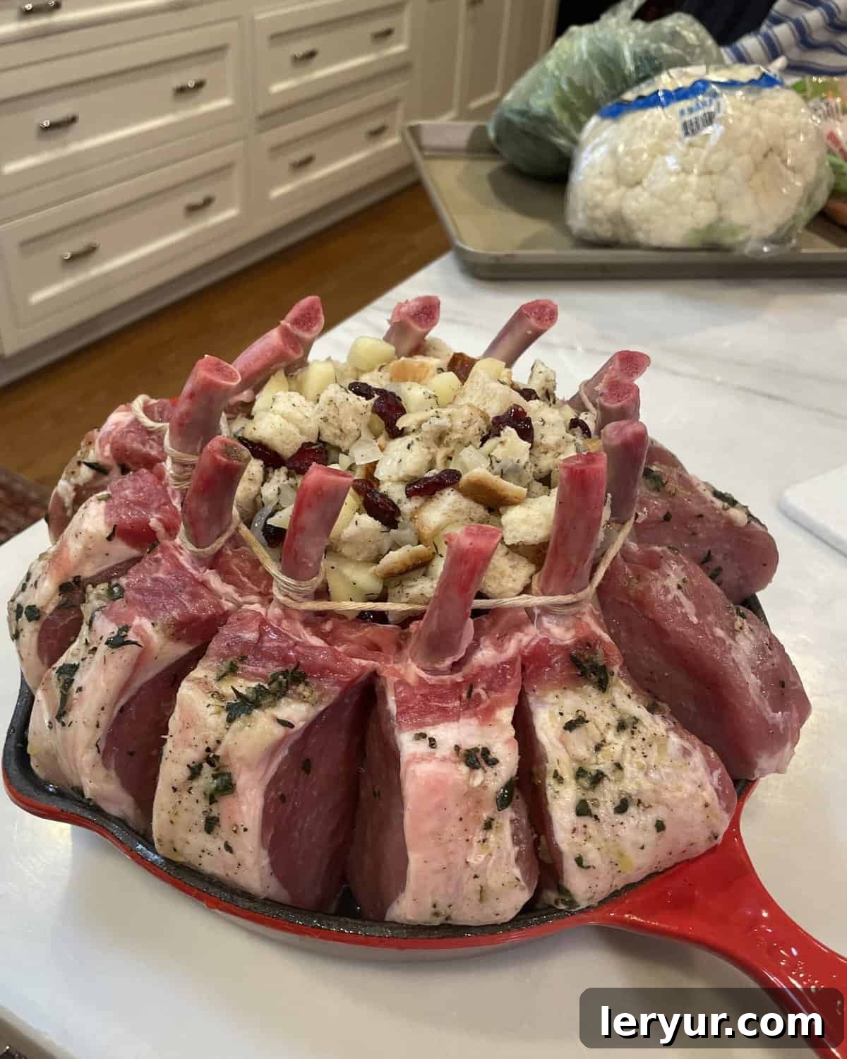 Regal Pork Crown with Spiced Apple Filling 4 A raw Crown Pork Roast with Apple Pecan Stuffing, beautifully prepared and ready to be placed into the oven for roasting.