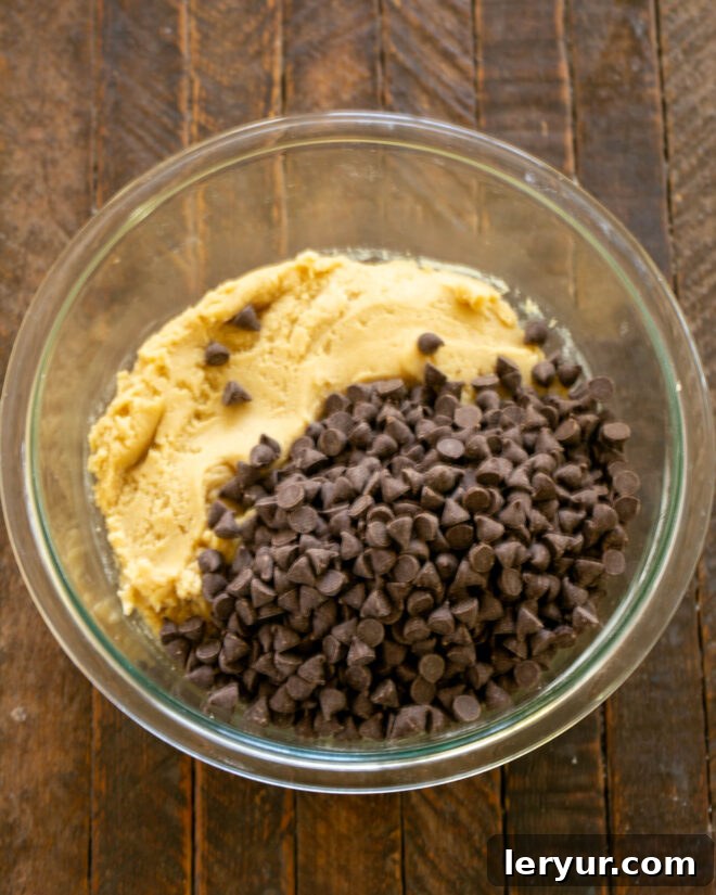 Decadent Caramel Chocolate Chip Bars 7 Chocolate chips poured over dough.