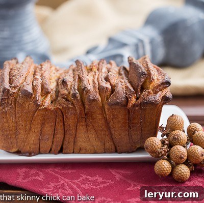Cinnamon Pull Apart Coffee Cake - a fun yeast bread filled with cinnamon sugar Cinnamon Pull Apart Coffee Cake on a white platter