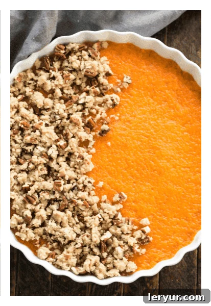 Sweet Potato Casserole with part of topping added, showing the preparation step.