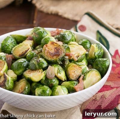Skilllett Brussels Sprouts with Bacon, Shallots and Garlic - A flavor packed Brussels sprouts recipe cooked on the stovetop Brussels Sprouts with Bacon, Shallots and Garlic in a white serving bowl