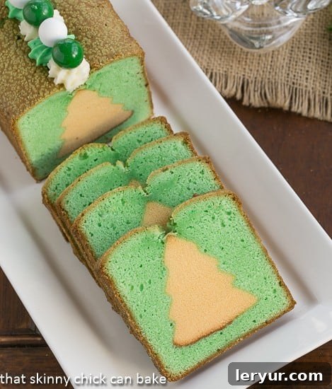 Holiday Cream Cheese Pound Cake - a hidden Christmas tree in every slice! Closeup of Holiday Cream Cheese Pound Cake with green Christmas tree cutouts inside