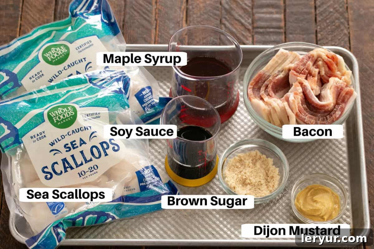 Maple Glazed Bacon Wrapped Scallops 3 Maple Glazed Sea Scallops Ingredients laid out on a metal sheet pan with labels, including maple syrup, soy sauce, Dijon mustard, brown sugar, sea scallops, and bacon slices.