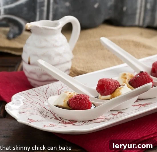 Balsamic Raspberries with Mascarpone Cream beautifully arranged in Chinese Soup Spoons on a festive red and white serving tray