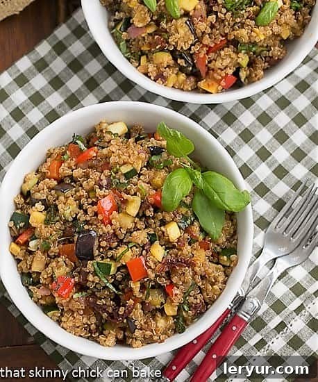 Overhead view of two aesthetically arranged bowls of Quinoa Salad with Roasted Vegetables, highlighting the fresh ingredients and inviting presentation
