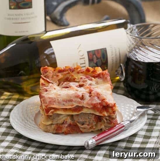 A perfectly sliced piece of Easy Sausage and Mushroom Lasagna, revealing its delicious layers of pasta, rich sauce, savory sausage, tender mushrooms, and melted cheese, served on a crisp white plate, ready to be enjoyed.