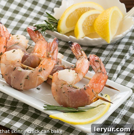 Prosciutto-Wrapped Rosemary Shrimp 2 A platter of beautifully grilled Rosemary Prosciutto Shrimp, perfectly cooked and ready to serve.
