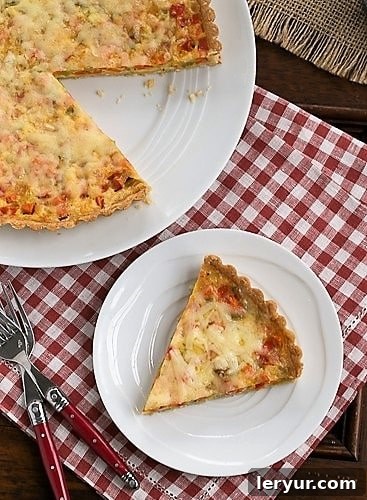 Quiche Maraichere slice removed from serving plate