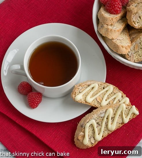 Cantuciini or Almond Biscotti: A terrific accompaniment to your cup of coffee or tea, these twice baked cookies hail from Tuscany. Overhead view of two Cantuciini or Almond Biscotti next to a cup of tea
