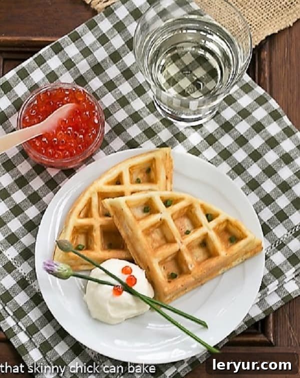 Smoked Salmon Waffles - Waffles with a savory twist! Smoked Salmon Waffles on a white plate from above, showcasing their golden texture and flavorful additions.