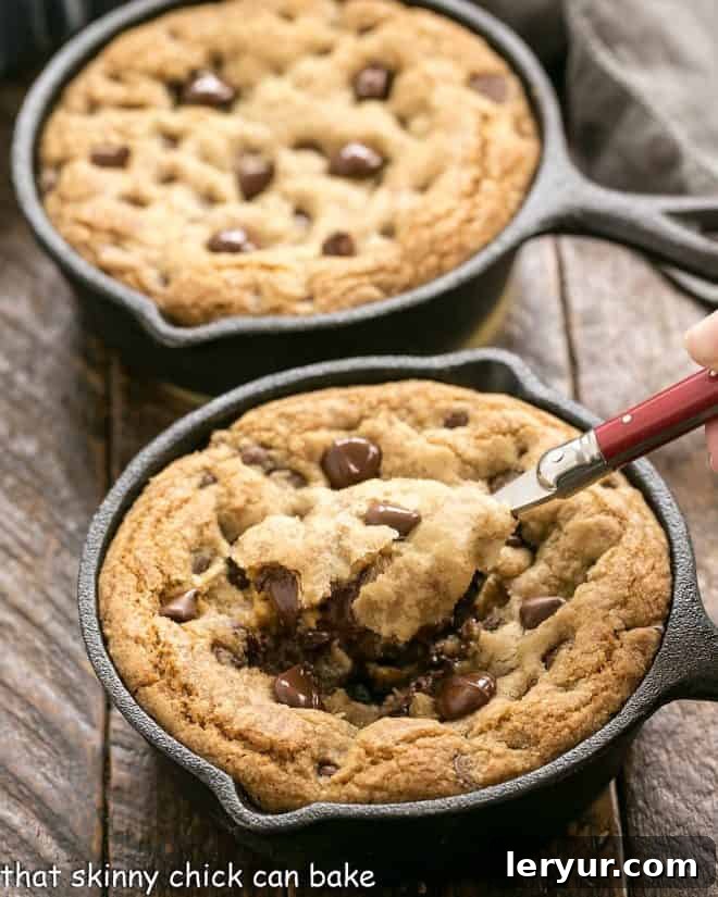 Homemade Pizookie Perfection 2 Two pizookies with a spoon removing a bite from the one up front