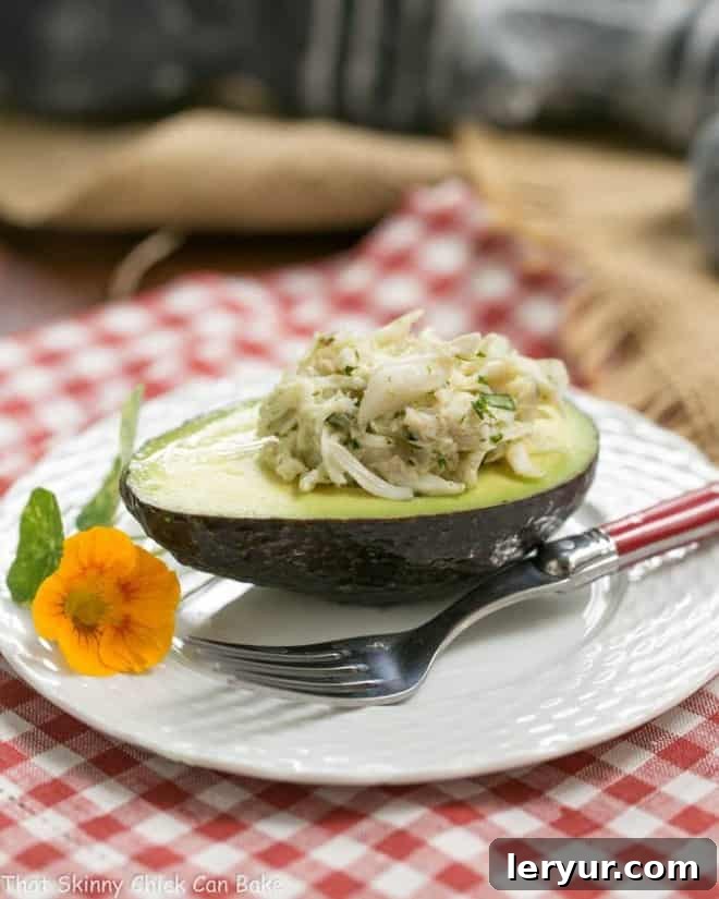 Crab Avocado Ravioli - An elegant, delectable crab salad presentation! Crab Avocado Ravioli elegantly presented on a white plate, highlighting its fresh ingredients and artful arrangement.