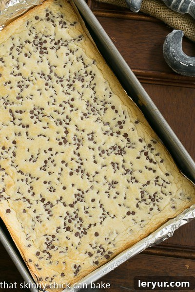 Perfect White Chocolate Brownies: A Family Favorite Freshly baked White Chocolate Brownies cooling in a baking pan, showing their golden crust.