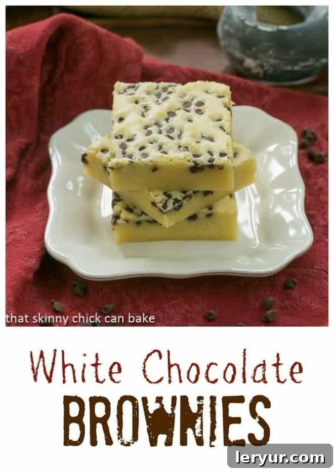 White Chocolate Brownie Close-Up: Irresistibly Fudgy A close-up of a White Chocolate Brownie slice, showcasing its rich, dense texture and scattered chocolate chips.