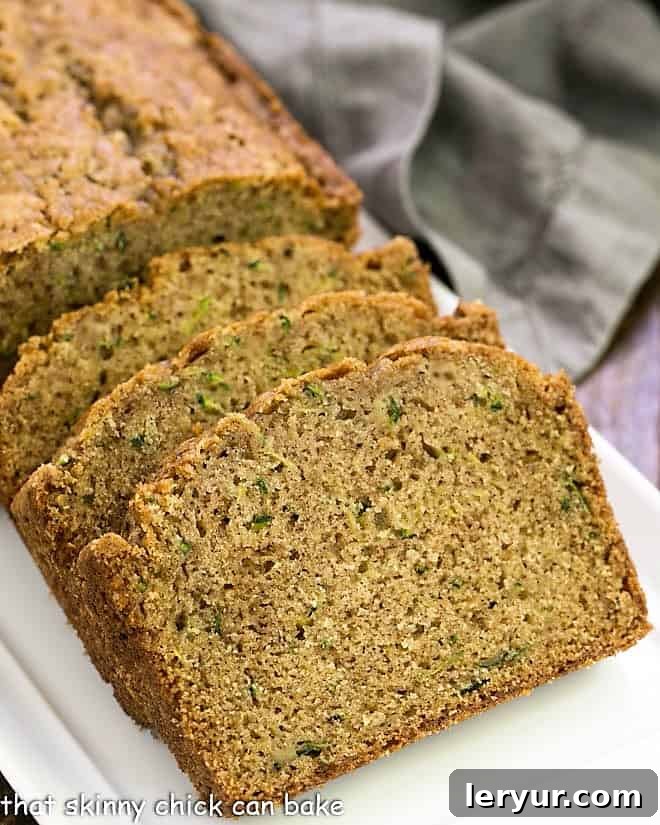 Grandma's Tried and True Zucchini Bread 10 Process shot #5 of baked and sliced zucchini bread.