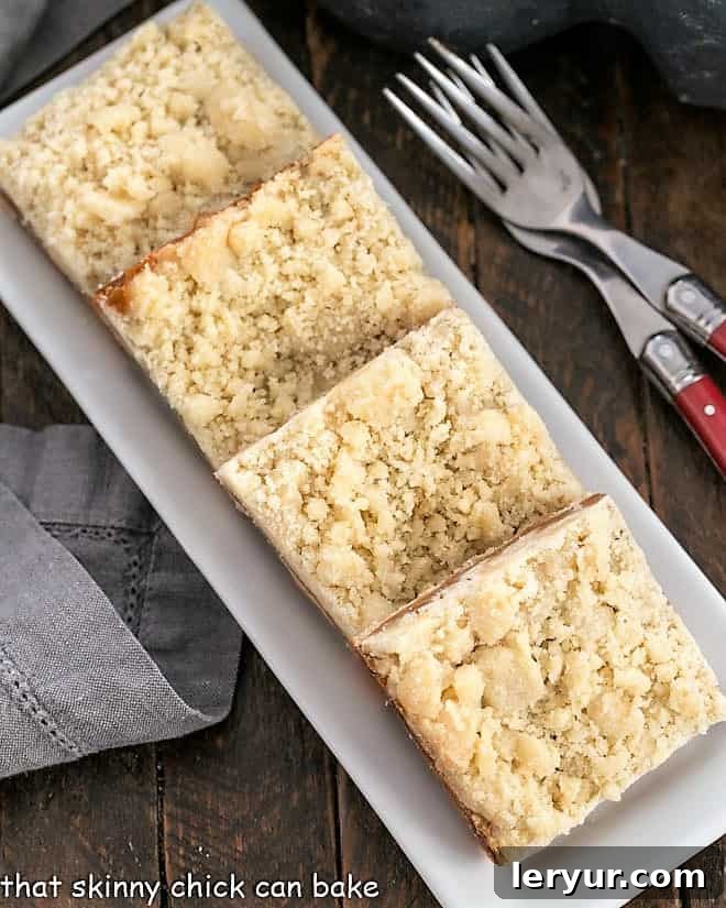Caramel Butter Bars - Simple flavors with delicious results! An inviting overhead view of freshly baked Caramel Butter Bars presented on a pristine white tray, ready to be enjoyed.