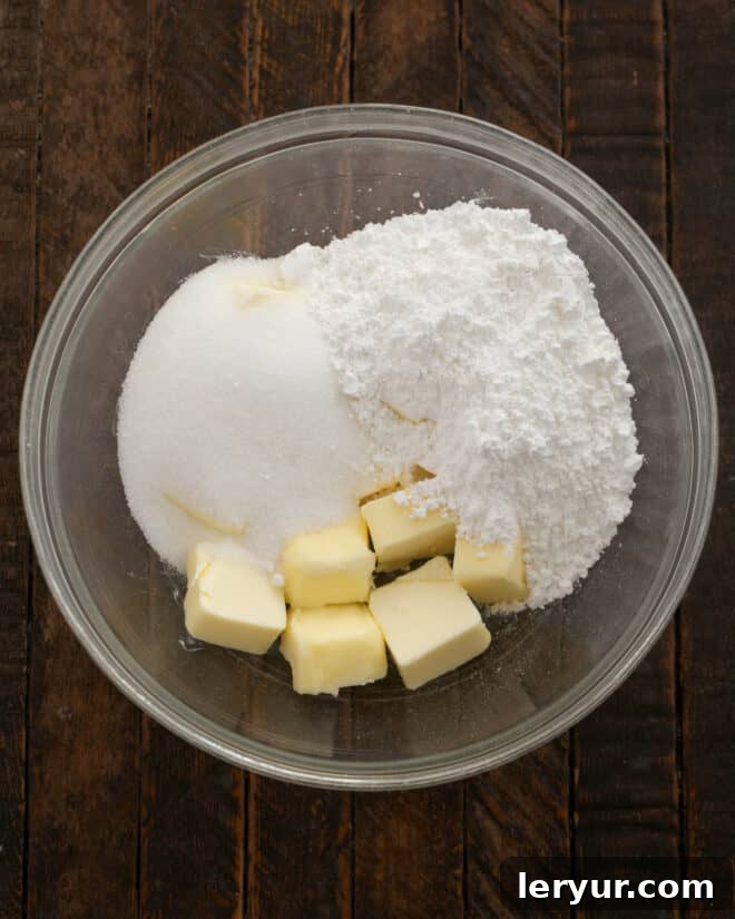 Golden Caramel Squares 4 Softened butter and sugars are added to a large mixing bowl.