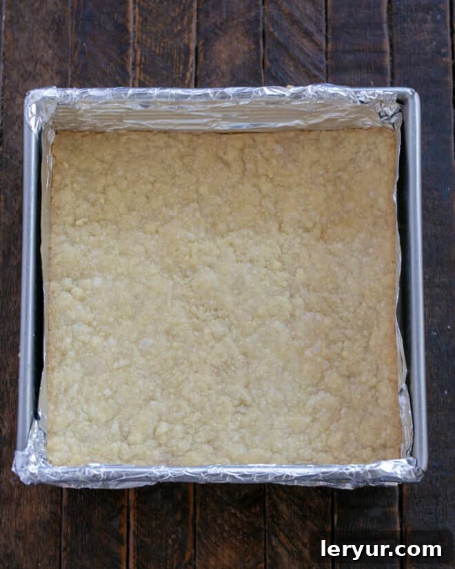 Golden Caramel Squares 7 The shortbread crust is baking in the oven.