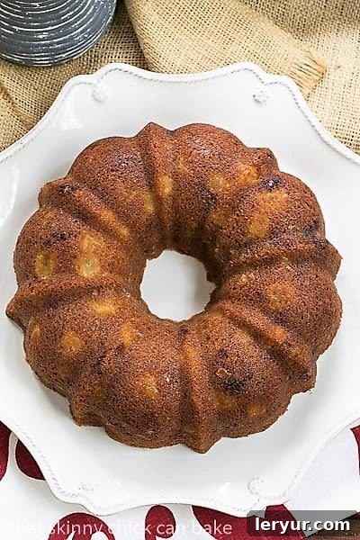 Apple Ginger Coffee Cake - A moist, delectable brunch, breakfast or dessert recipe! Full of autumn spices and crystallized ginger. Overhead view of a beautifully baked Apple Ginger Coffee Cake, showcasing its streusel topping
