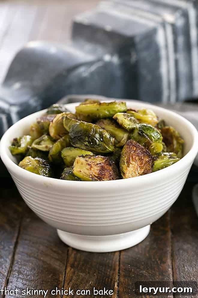 Honey Balsamic Brussels Sprouts - Transform these once dreaded vegetables into an amazing, flavorful side dish with this easy roasting and glazing method A serving bowl filled with perfectly roasted Honey Balsamic Brussels Sprouts, ready to be enjoyed.