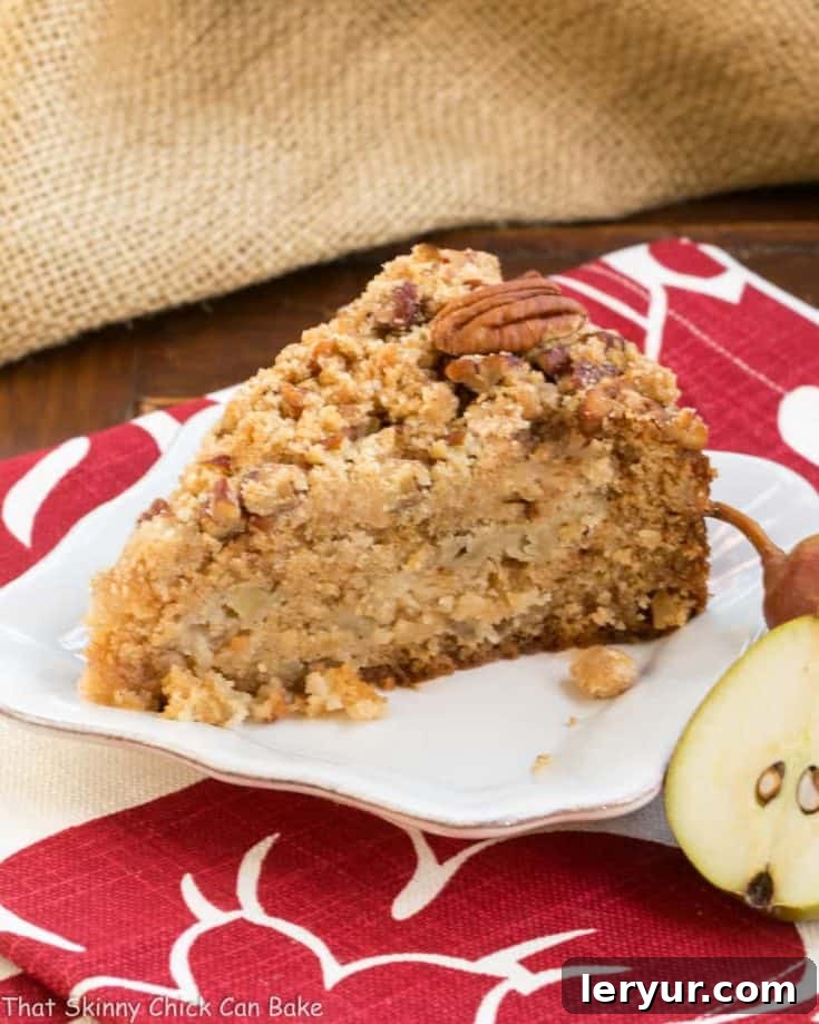 The star of the show: a glorious Pear Streusel Coffee Cake, showcasing its perfect crumb and golden streusel topping, ready to be enjoyed.