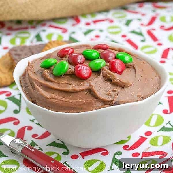 Brownie Batter Dip in a white bowl topped with M&M's