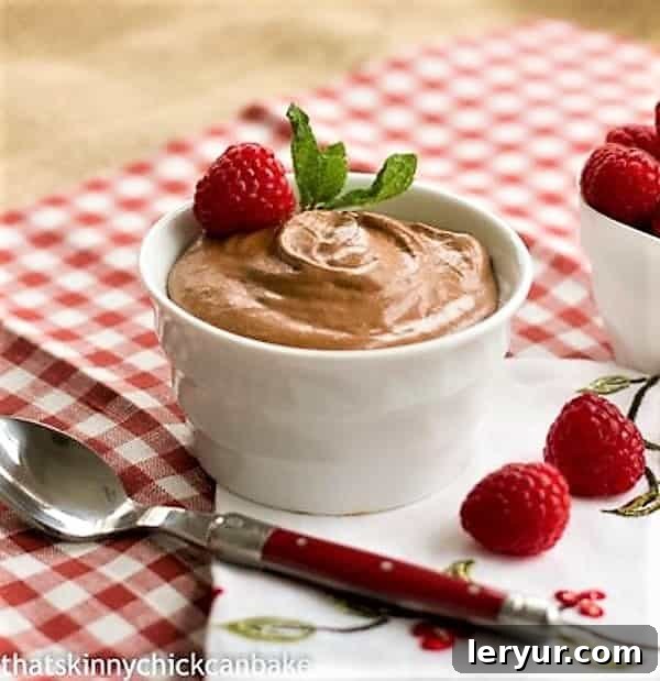 Grand Marnier Chocolate Cloud 2 Chocolate Mousse with Grand Marnier in a white ramekin, ready to be served or enjoyed with a spoon.